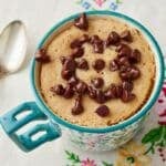 Chocolate Chip Mug Cake with a spoon on the left.