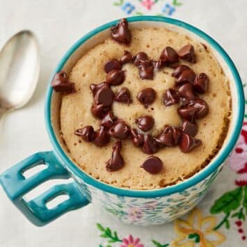 Chocolate Chip Mug Cake with a spoon on the left.