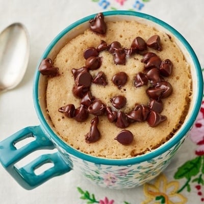 Chocolate Chip Mug Cake with a spoon on the left.
