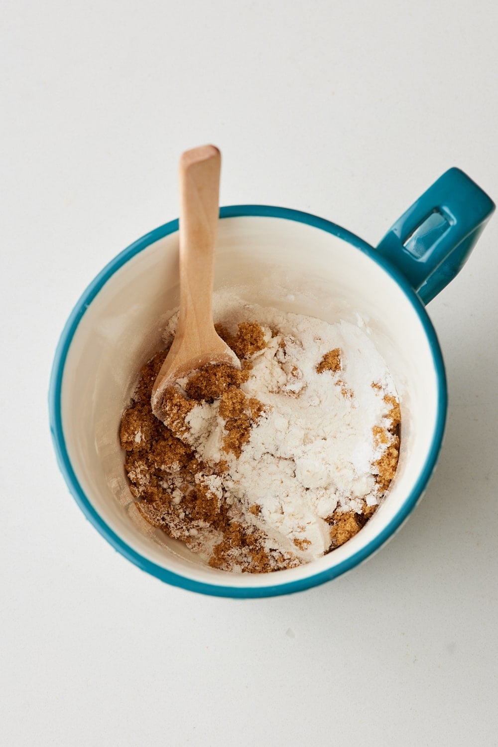 Dry ingredients mixed in a mug for chocolate chip mug cake. 