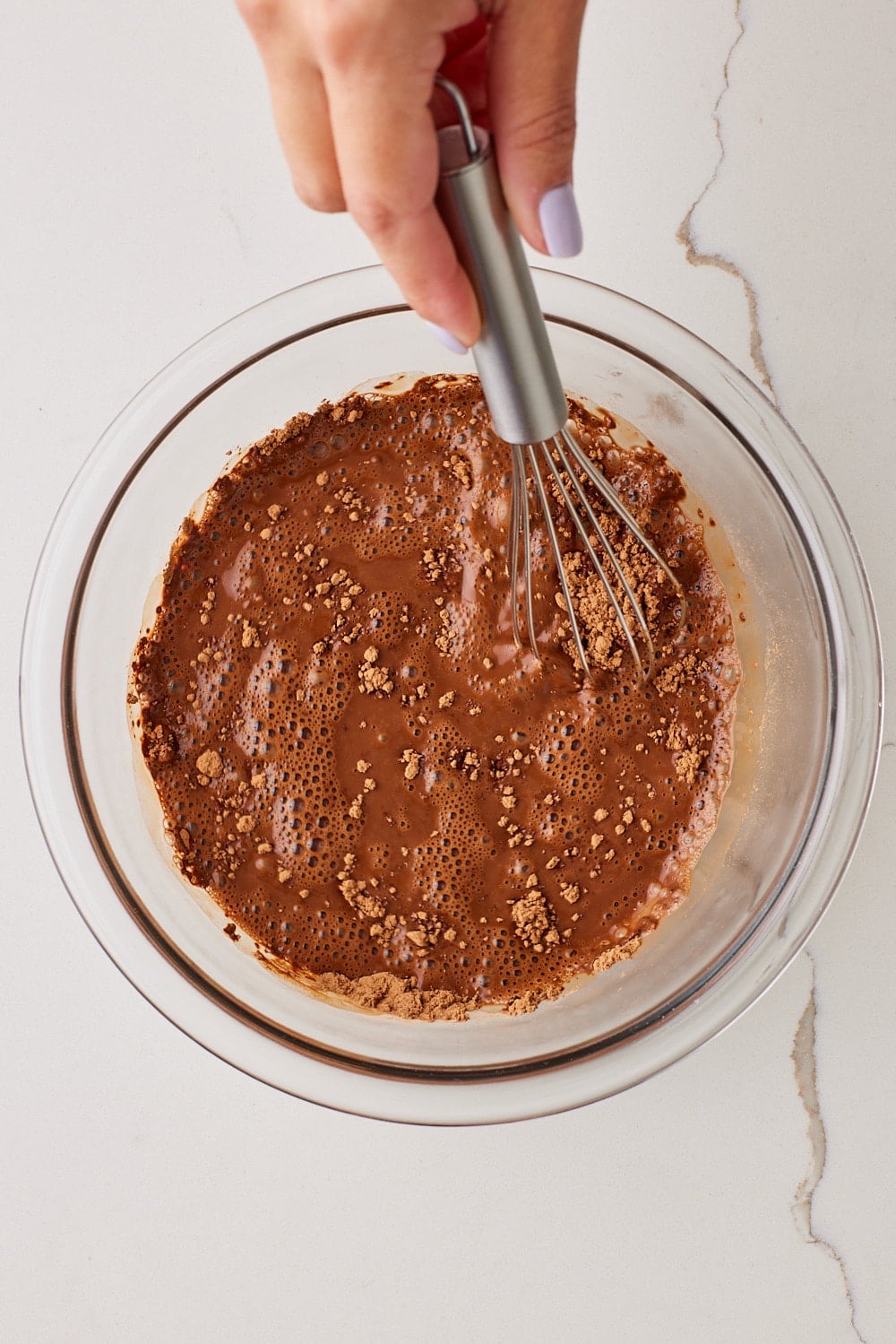 Chocolate Mayo Cake3 In a large bowl, whisk together the hot water and cocoa powder.