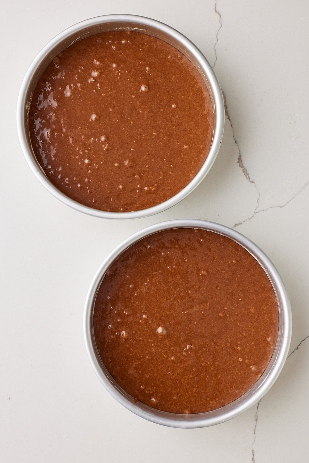 Chocolate Mayo Cake7 Divide the batter evenly between the prepared pans and smooth the tops.