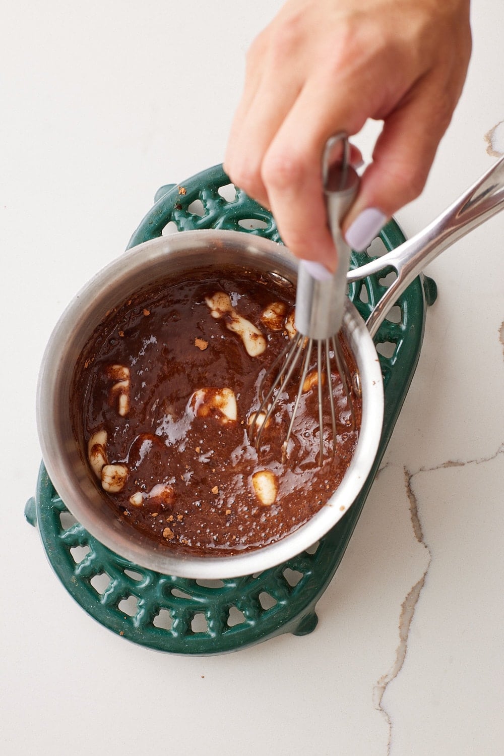 Coca Cola Cake12 Remove from the heat and whisk in the butter, powdered sugar, and cocoa powder until smooth.