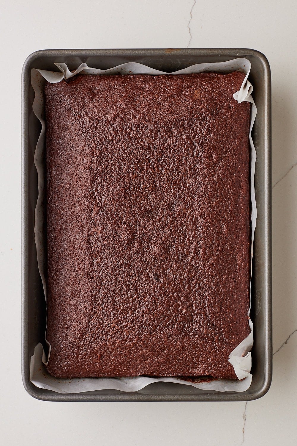 Coca Cola Cake9 Top-down view of a baked Coca Cola Cake in the baking tray.