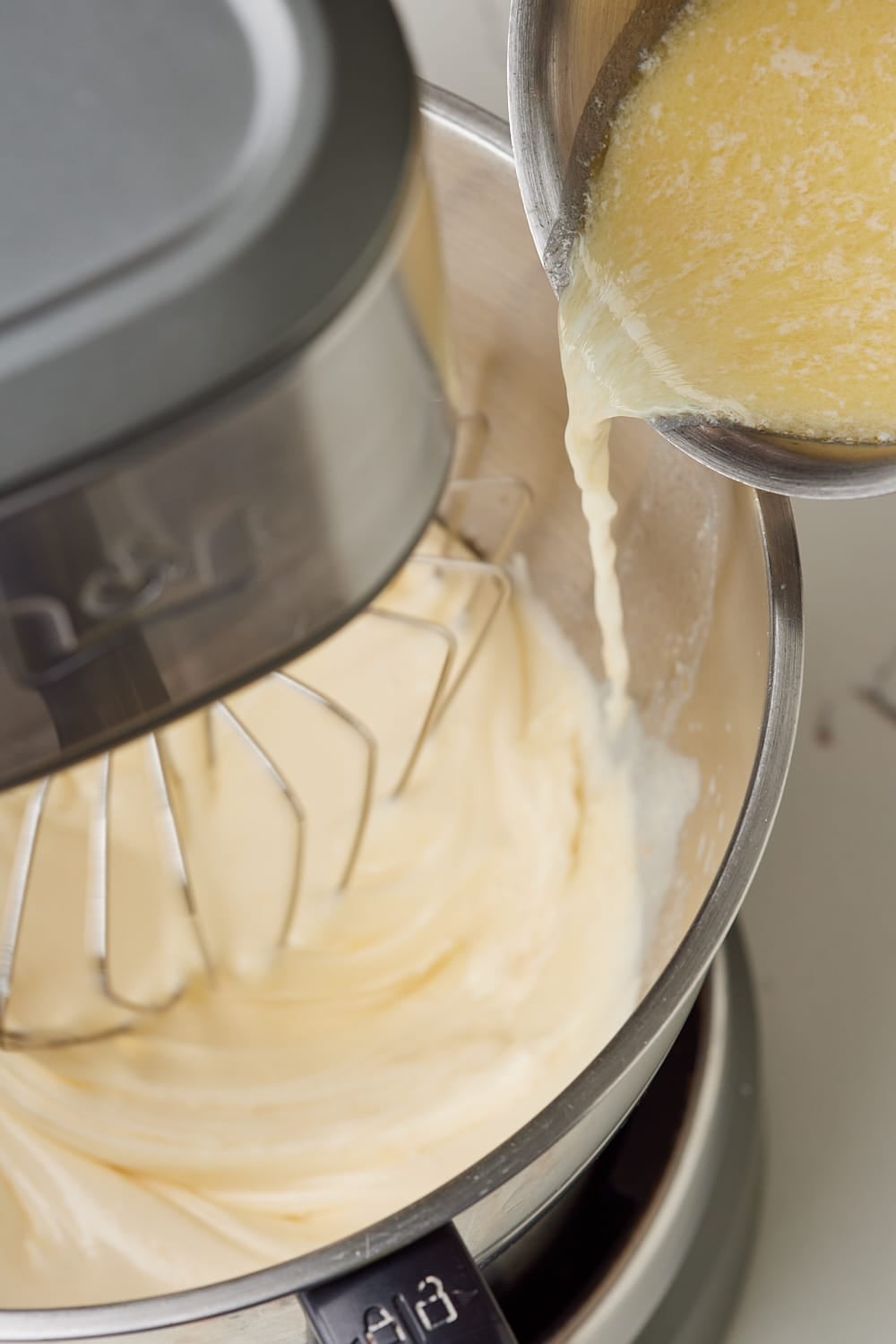 Hot Milk Cake6 Streaming in hot milk mixture.