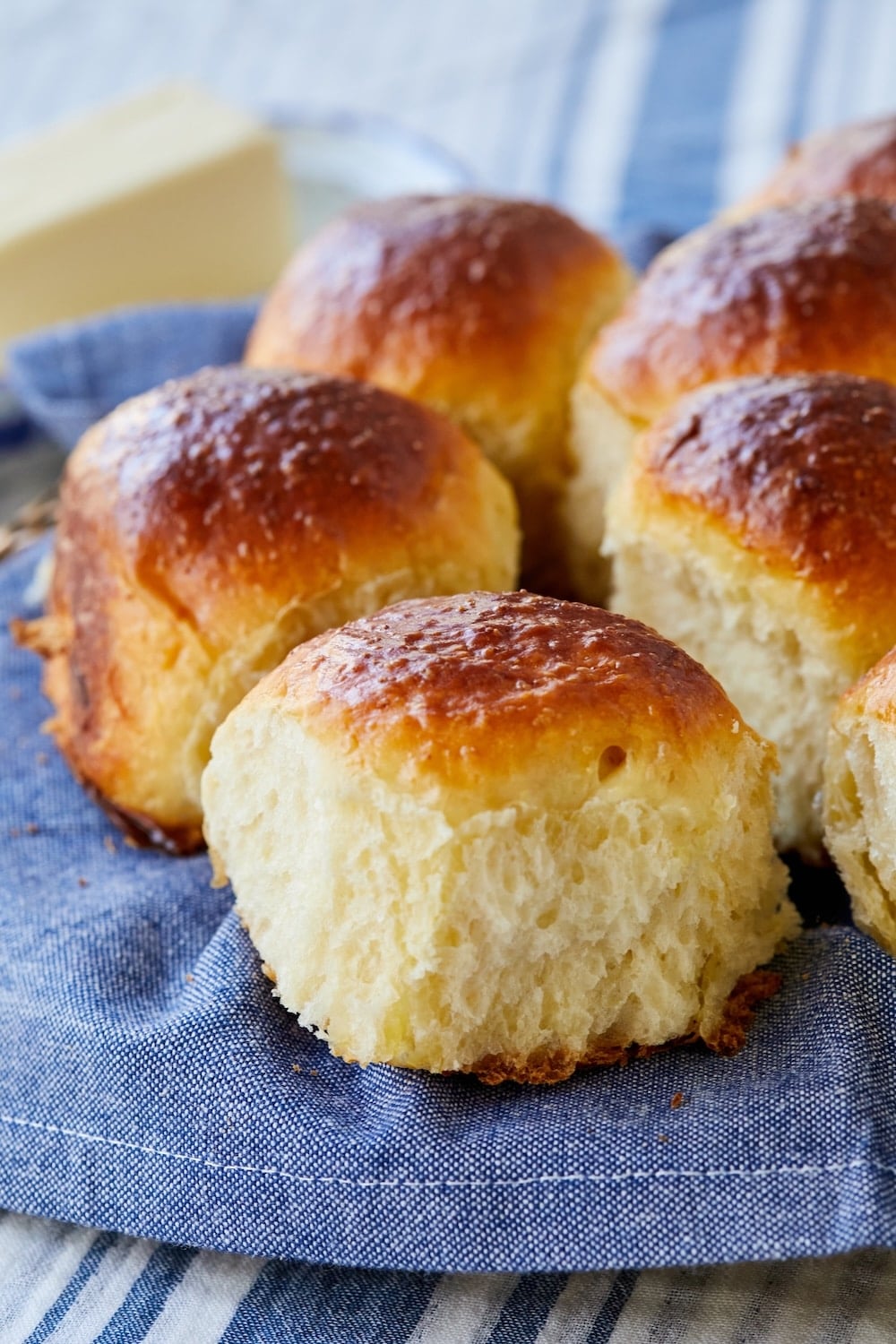 Close-up shot at big fluffy golden Japanese Milk Bread Rolls on the wire rack. 