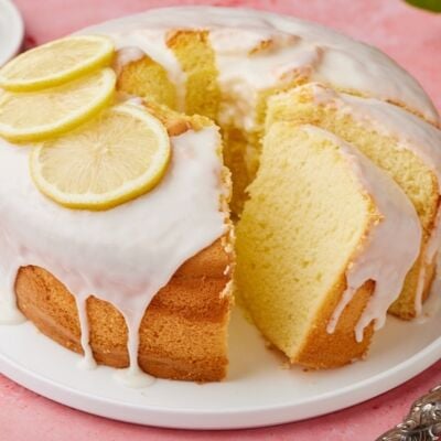 Lemon Chiffon Cake with glaze and fresh lemon slices.
