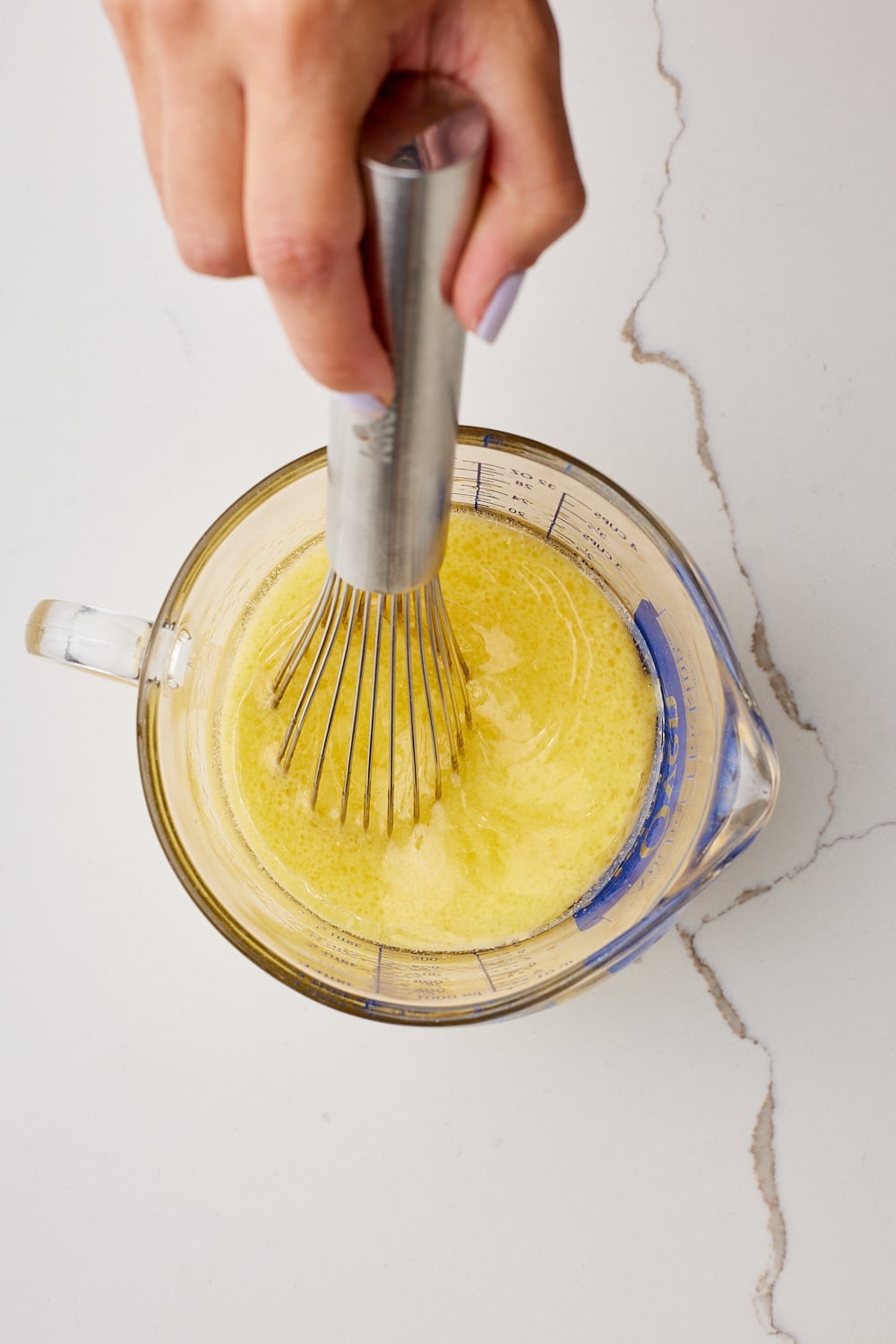 Lemon Chiffon Cake wet ingredients in a jug. 