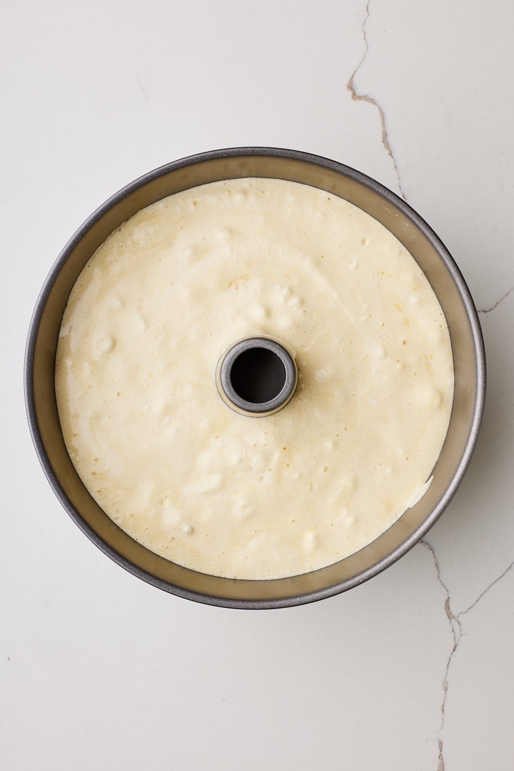 Pour into the tube pan and smooth the top. 