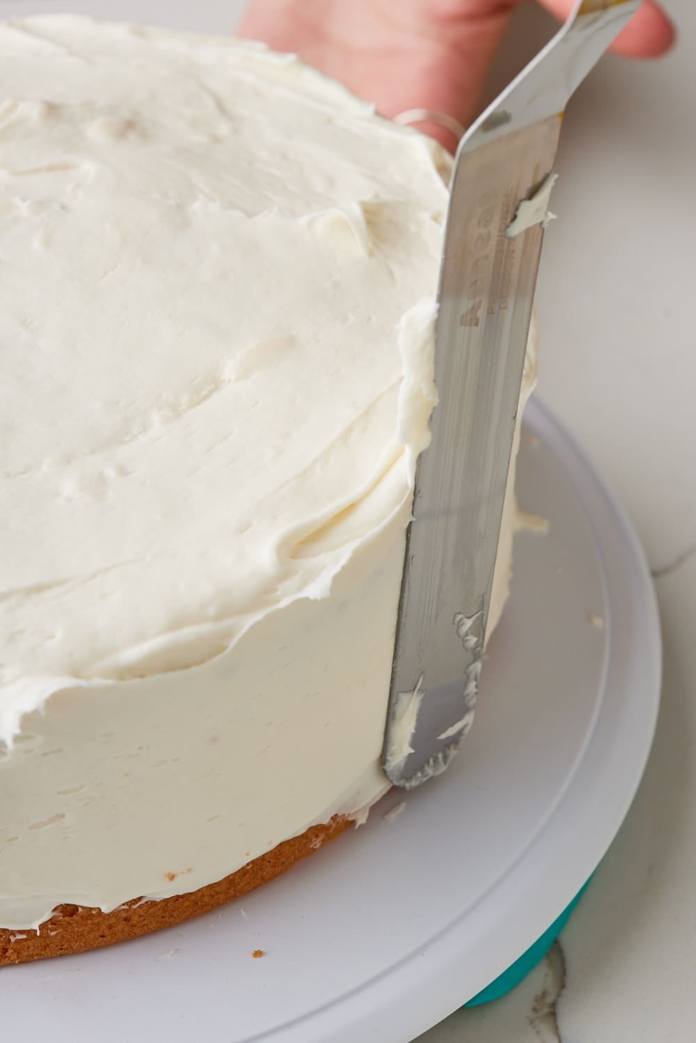 Pineapple Coconut Cake14 Frost the cake with the Cream Cheese Frosting.