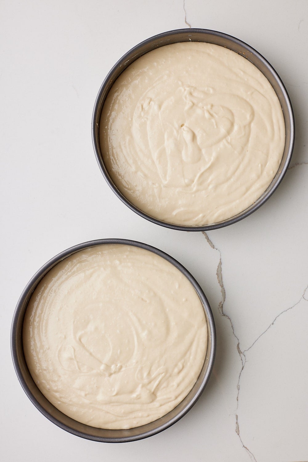 Pineapple Coconut Cake9 Add batter to pans. Divide the batter evenly between the prepared pans.