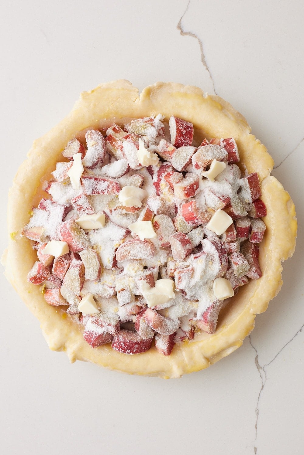 Rhubarb Pie5 Rhubarb Pie filling is put in the bottom crust.