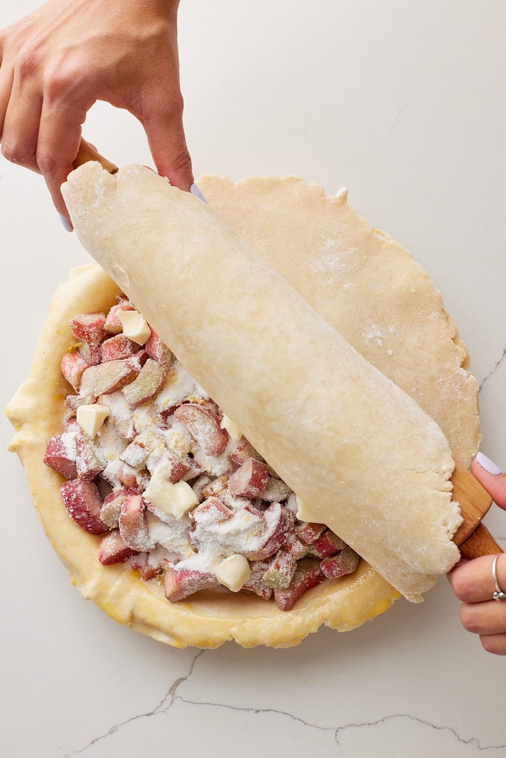 Rhubarb Pie6 Roll out the second portion of dough and drape over the filling.