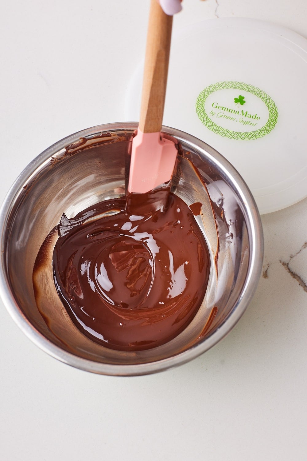 Melted chocolate in a microwave-safe bowl. 