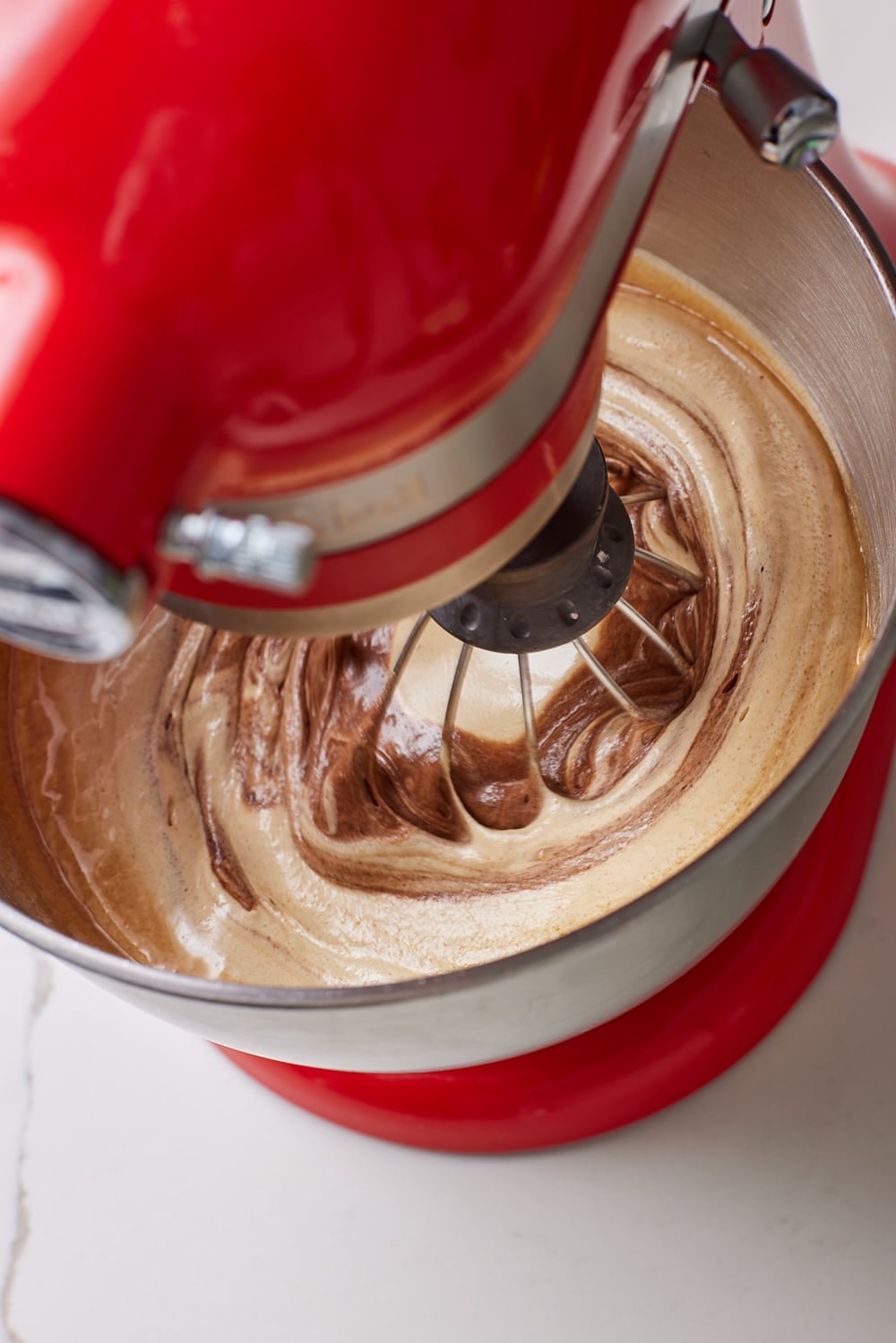slowly blend in the melted chocolate butter mixture until fully incorporated.