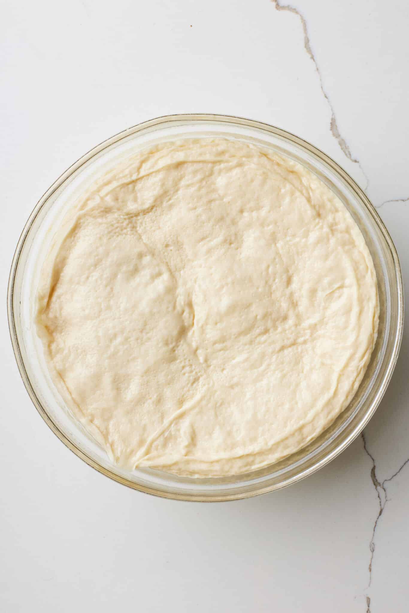 Let the dough rise until it doubles in size.