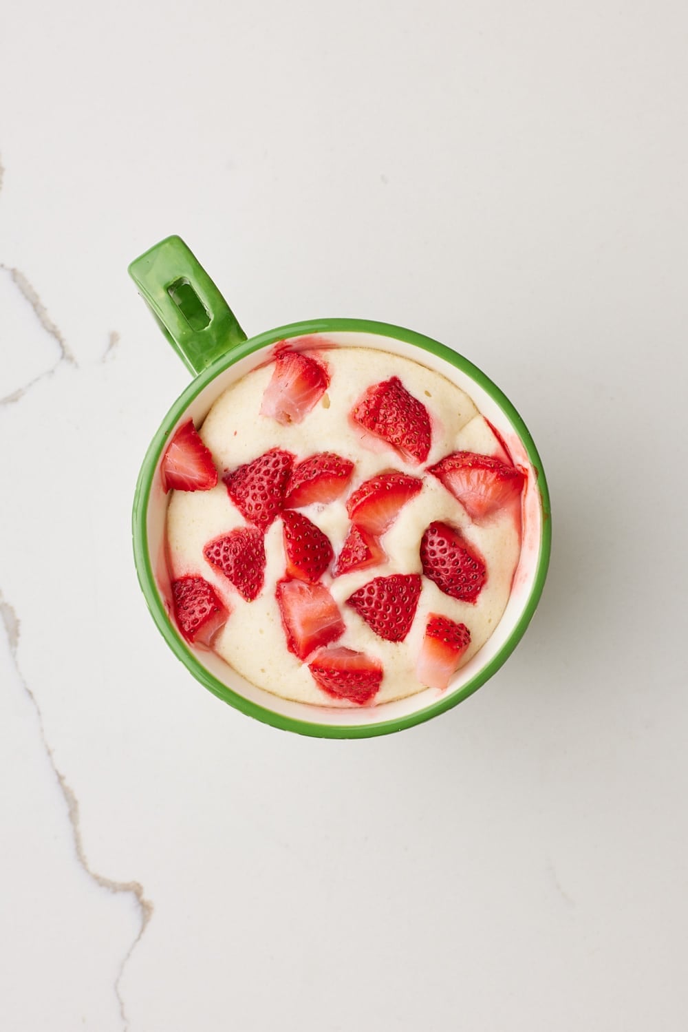 Strawberry Shortcake Mug Cake7 Top down view of the set shortcake with strawberries.
