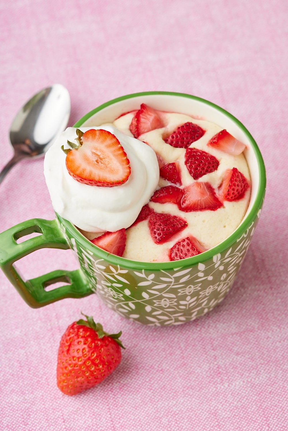 Strawberry Shortcake Mug Cake8 Strawberry Shortcake Mug Cake served with fresh strawberries and whipped cream.