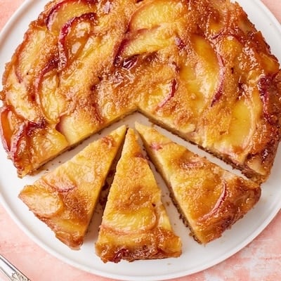 Top-down view of Peach Upside Down Cake, with three slices.