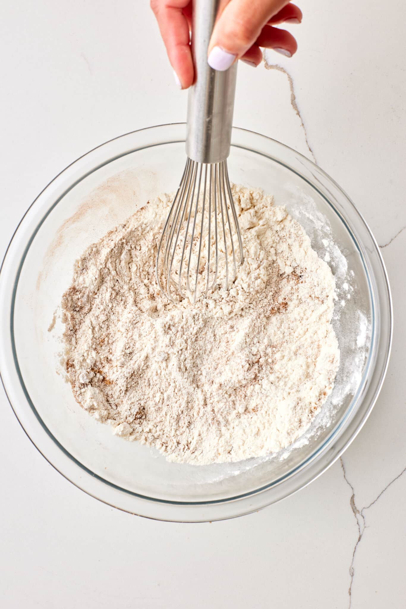 Apple Cider Muffins3 Mix dry ingredients in a bowl for Apple Cider Muffins.
