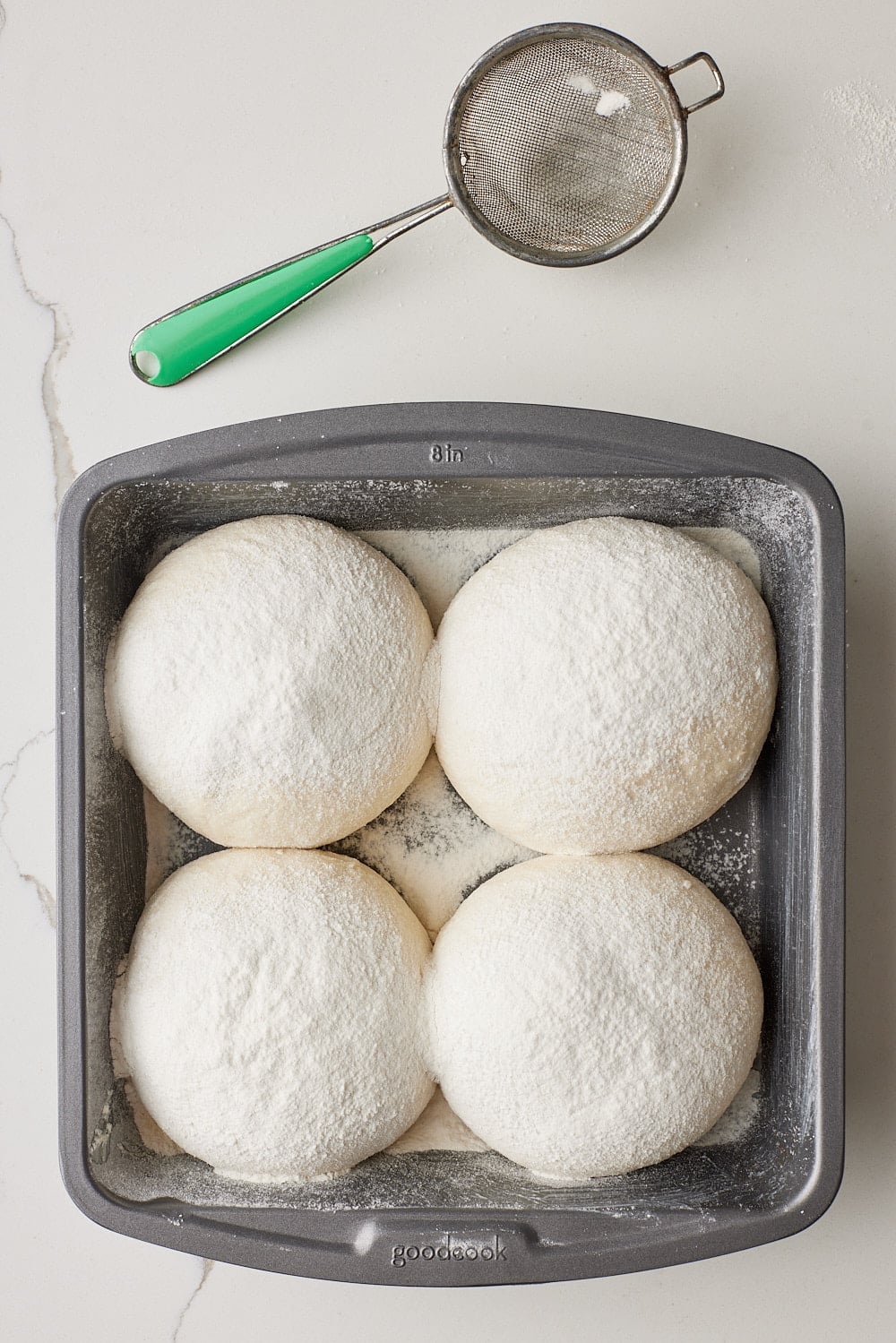 Batch Bread8 Four roll dough balls are placed in the pan with seam side down.