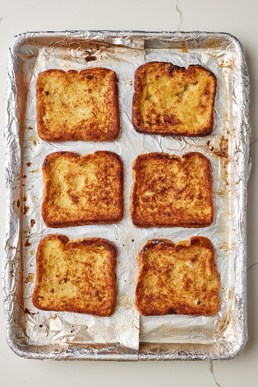 Sheet Pan French Toast6 Top down view of Sheet Pan French Toast baked until the tops are golden brown.