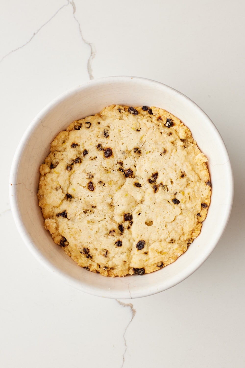 Spotted Dick10 Baked Spotted Dick pudding studded with currants in a heatproof pudding basin.