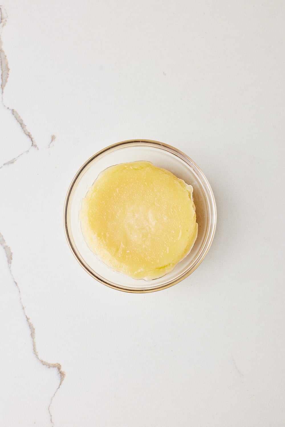 Overhead view of child, solid browned butter. 