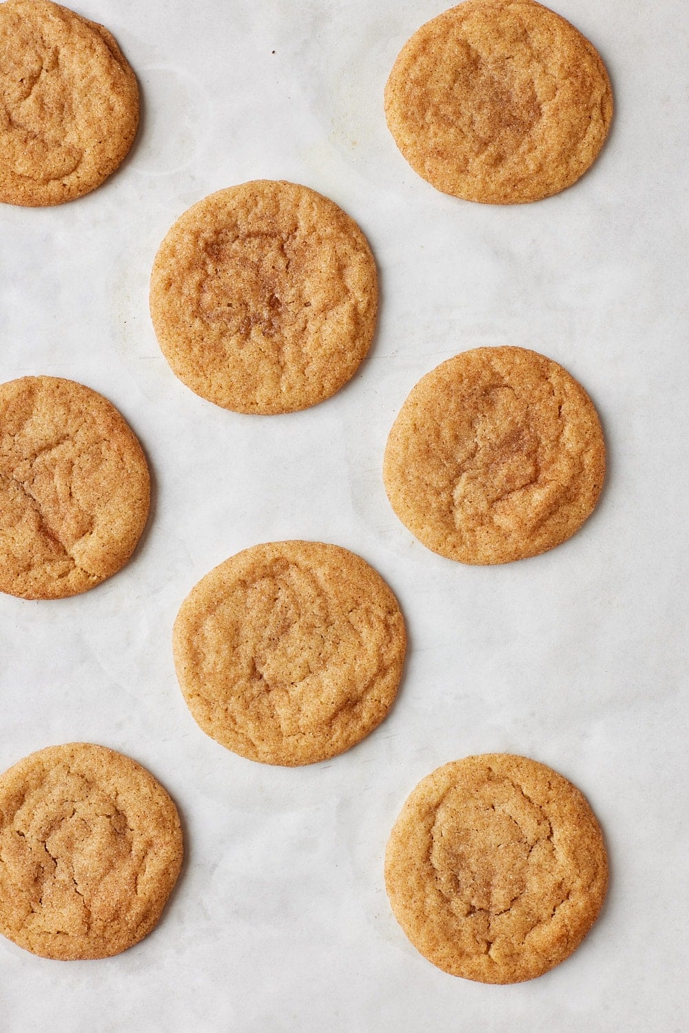 Brown Butter Snickerdoodles8 Baked Brown Butter Snickerdoodle cookies with crinkled top.